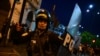 Riot police clash with supporters of former President Pedro Castillo during a protest to demand the closure of Congress and the release of Castillo in downtown Lima, on Dec. 15, 2022. 