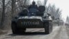 Бронетранспортер з написом «Росіянин» на Донеччині 12 березня 2022 р.