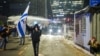 Security forces use a water cannon to disperse the people attending a demonstration against Israeli Prime Minister Benjamin Netanyahu and his nationalist coalition government's plan for judicial overhaul, in Tel Aviv, Israel, March 27, 2023.