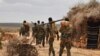 FILE - A handout photo taken June 10, 2016, and released by AMISOM shows soldiers serving under the African Union Mission in Somalia (AMISOM) on foot patrol in Halgan village, Hiran region. Civilians in the region have been targetted by recent al-Shabab a