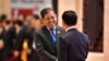Myanmar's secretary of foreign affairs, Aung Kyaw Moe, left, shakes hands with Laotian Foreign Minister Saleumxay Kommasith during the ASEAN meeting in Vientiane, Laos, on July 25, 2024. 