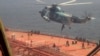 FILE - In this image from video released April 28, 2023, by the Iranian Navy, Iranian marines rappel onto the Advantage Sweet as they seize the oil tanker in the Gulf of Oman. The tanker was sailing toward international waters on July 11, 2024, tracking data show.