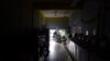 Laundromat owner Jesus Vazquez pauses before closing his San Juan, Puerto Rico, shop to comply with the government's coronavirus curfew on March 20.
