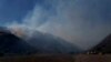 Firefighters keep watch on hot spots from the Sharp Fire in Simi Valley, Wednesday, July 3, 2024. 