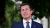 Transportation Secretary Pete Buttigieg talks with reporters at the White House July 23, 2024. Regulators are investigating how Delta Air Lines is treating passengers affected by canceled and delayed flights as the airline struggles to recover from a global technology outage.