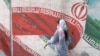 FILE - An Iranian woman walks in a street in Tehran, Iran, April 9, 2023. Majid Asgaripour/WANA (West Asia News Agency) via REUTERS