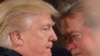 FILE PHOTO: U.S. President Donald Trump talks to chief strategist Steve Bannon during a swearing in ceremony for senior staff at the White House in Washington