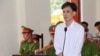 Nhà hoạt động Hoàng Đức Bình tại phiên tòa phúc thẩm ngày 24/4/2018 ở Nghệ An. Photo TTXVN.