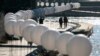 Luminous white balloons line the former route of the Berlin Wall to mark 25 years of German reunification, Nov. 7, 2014.