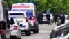 Police block streets around the Vladislav Ribnikar school in Belgrade, Serbia, May 3, 2023.