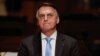 FILE - Brazil’s former President Jair Bolsonaro attends an event at the Municipal Theatre in Sao Paulo on March 25, 2024.
