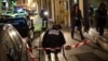 Policemen collect evidence on Dec. 21, 2014 in Dijon on the site where a driver shouting "Allahu Akbar" ("God is great") drove into a crowd injuring 11 people, two seriously. 