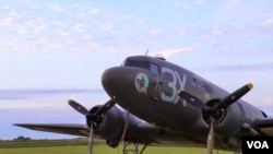 The "Drag 'Em Oot," a WWII-era Douglas DC-3 Dakota, which flew 2 sorties over Normandy on June 6, 1944, at the end of a day's flying, Normandy, June 5, 2014 (H. Ridgwell/VOA).