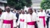 FILE - Archbishop Marcel Utembi, second left, president of the National Episcopal Conference of Congo (CENCO), and other Catholic bishops arrive for the signing of an accord at the interdiocesan center in Kinshasa, Jan. 1, 2017 following talks launched by