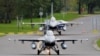 Belgian F-16 fighter jets, which will join the U.S.-led coalition against Islamic State militants in Iraq, prepare to take off the military air base in Florennes, Sept. 26, 2014. 
