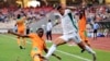 L'Algérien Baghdad Bounedjah taclé par l'Ivoirien Odilon Kossounou en 2022.