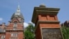 A sign stands in front of part of the Johns Hopkins Hospital complex, July 8, 2014, in Baltimore. Most medical students at Johns Hopkins University will no longer pay tuition thanks to a $1 billion gift from Bloomberg Philanthropies. 