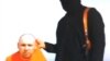 This still image from an undated video released by Islamic State militants on Tuesday, Aug. 19, 2014, purports to show journalist Steven Sotloff.