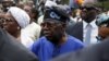 Presidential candidate Bola Ahmed Tinubu arrives at a polling station before casting his ballot in Ikeja, Lagos, Nigeria Feb. 25, 2023.