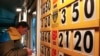 FILE - A man exchanges money at a currency exchange office in Kyiv. 