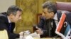 Abu-Rashed, right, Libyan representative at the Arab League, talks to his Egyptian counterpart, Tarek Adel, during an emergency meeting to discuss the conflict in Libya in Cairo, Jan. 5, 2015.