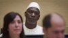  Thomas Lubanga (katikati) akisubiri hukumu yake katika mahakama ya ICC huko the Hague. 