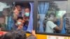 Para tahanan berangkat dengan bus setelah dibebaskan dari Penjara Insein di Yangon, Myanmar Rabu, 3 Mei 2023. (AP/Thein Zaw)