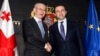 European Council President Herman Van Rompuy and Georgian Prime Minister Irakli Garibashvili (R) shake hands during their meeting in Tbilisi, Georgia, May 14, 2014.
