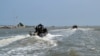 FILE - This May 5, 2009, photo provided by the Cameroonian Defence Ministry shows members of a Cameroonian Rapid Intervention Battalion near the peninsula of Bakassi, western Cameroon near the Nigerian border.