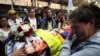 Amigos, familiares y partidarios del candidato presidencial ecuatoriano Fernando Villavicencio, un crítico abierto de la corrupción y el crimen organizado, asisten a un homenaje post-mortem en el Centro de Exposiciones de Quito, el 11 de agosto de 2023. [REUTERS/Henry Romero]