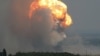 Asap dan api mengepul dari ledakan saat terjadi kebakaran di tempat latihan militer di distrik Kirovske, Krimea, 19 Juli 2023. (Foto: Reuters)