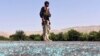 FILE - An Afghan soldier keeps watch during clashes with Islamic State (IS) militants in Kot district of Nangarhar province, Afghanistan, June 26, 2016. 