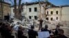 Members of the Kyiv Classic Orchestra perform "Requiem for the Dead" at the ruins of Okhmatdyt children's hospital, which was recently hit by a Russian missile, in Kyiv, Ukraine, July 12, 2024.