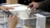 Voter casts his vote at a polling station in Sofia, April 2, 2023.