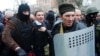 Pro-Russia militiamen detain the head of the regional police after storming the regional police building in the eastern Ukrainian city of Horlivka (Gorlovka), near Donetsk, on April 14, 2014.