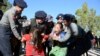 Police officers arrest activists during a protest against a statue of General Aung San, Myanmar's independence hero and the father of leader Aung San Suu Kyi in Loikaw, Kayah state, Myanmar February 7, 2019. Picture taken February 7, 2019. REUTERS/Stringe
